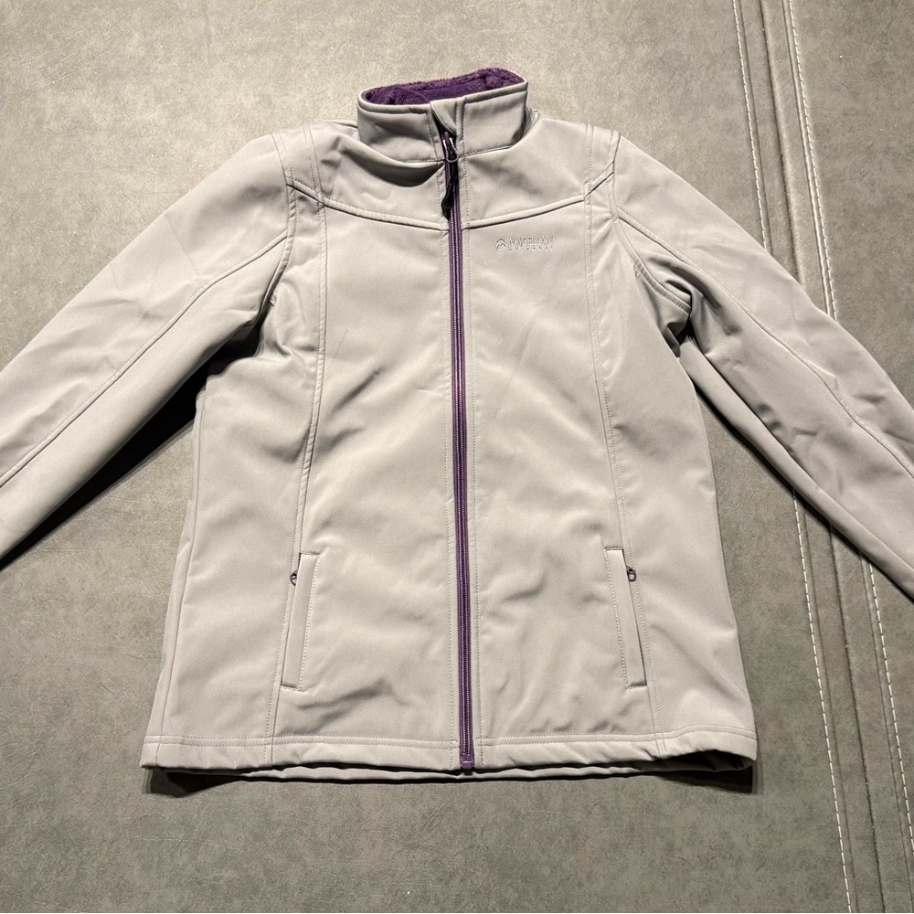 Magellan Outdoors Girl’s Light Gray Jacket with Purple Trim and fleece lining.